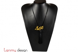 Necklace designed with yellow metal dragon, black tassel
